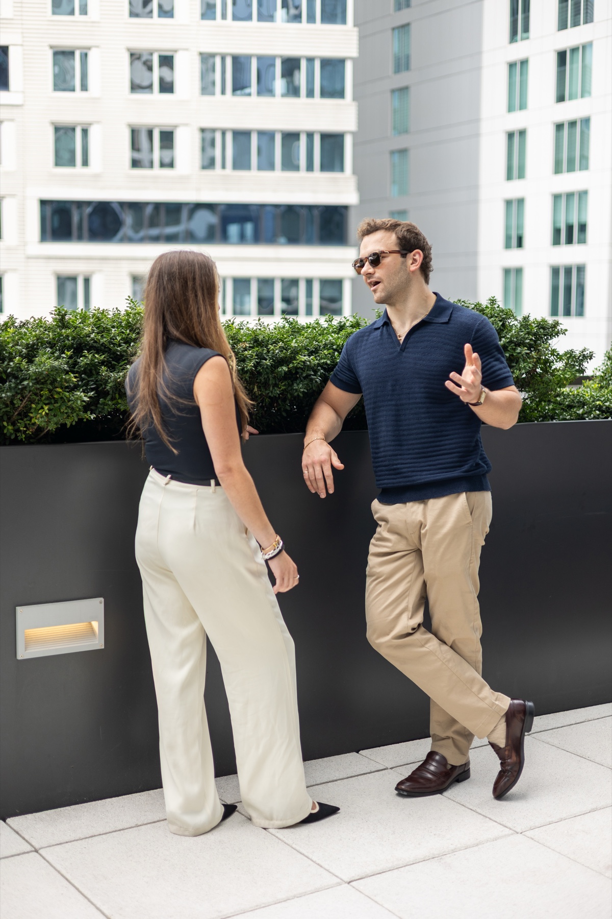 Lindsey Kinsellagh and Derek Jesiolowski speaking together in Boston Seaport