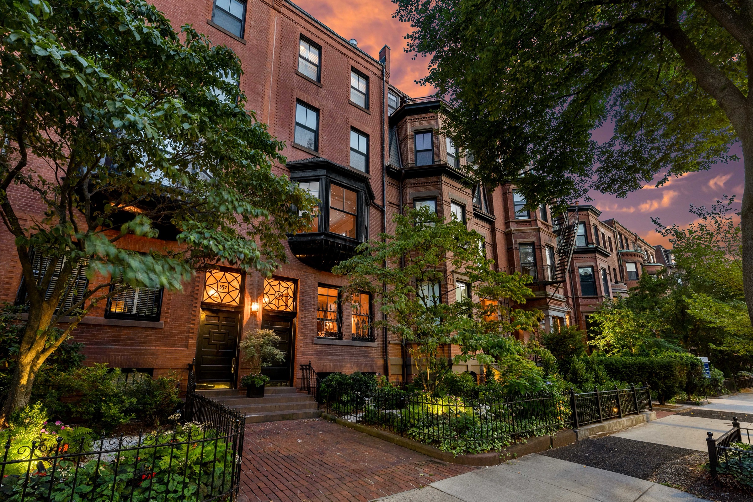 Historic brick homes along Beacon Street in Back Bay at sunset