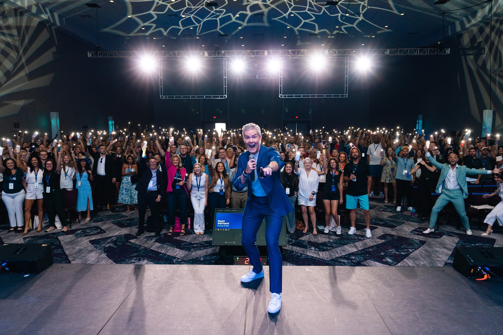 Ryan Serhant speaking to a large audience